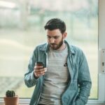 man on cell phone emotionally disconnected