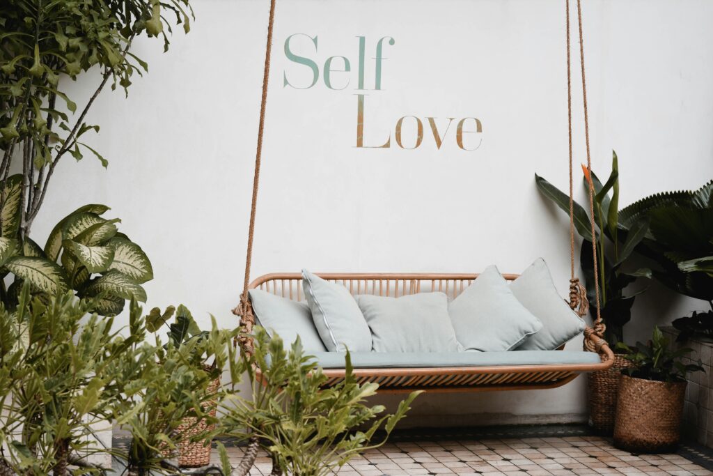 self love is on a wall with a comfortable space