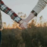couple in relationship holding hands