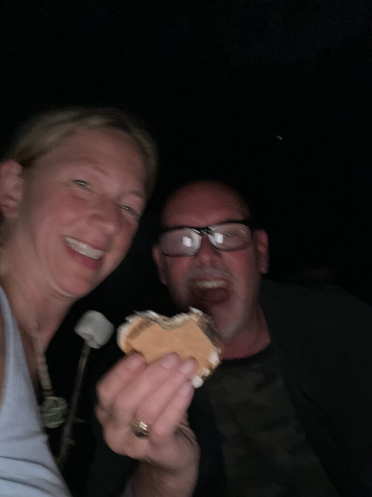 Playing like kids with smores camping. Fun in relationships